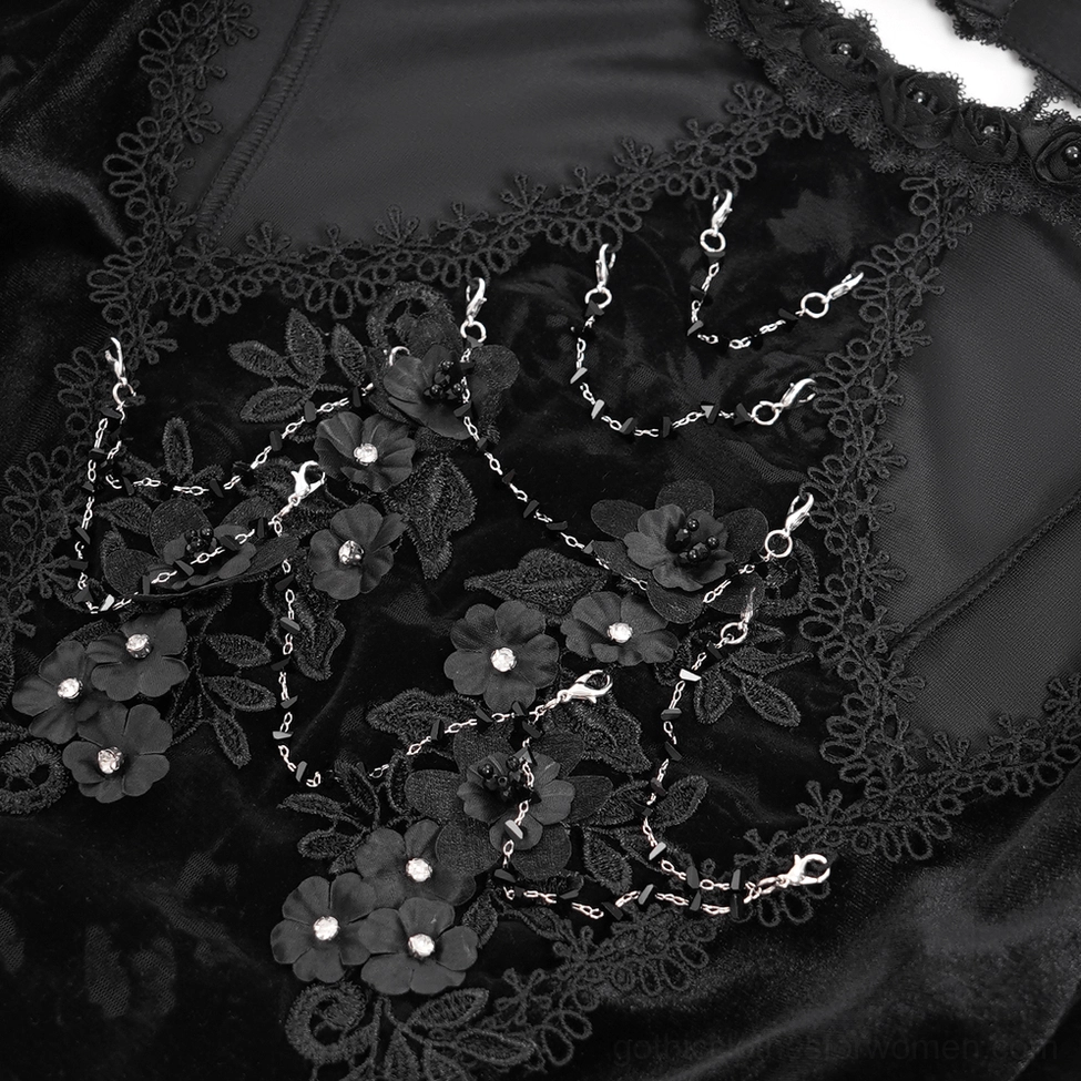 Full-length front view of black gothic lace top on mannequin featuring pearl embellishments and asymmetric hemline