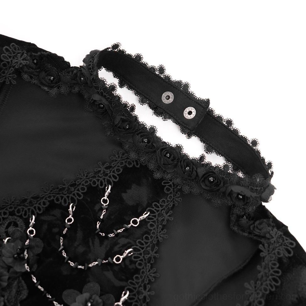 Close-up detail of gothic lace top neckline featuring black rose appliques and metal chain accents with hook closure