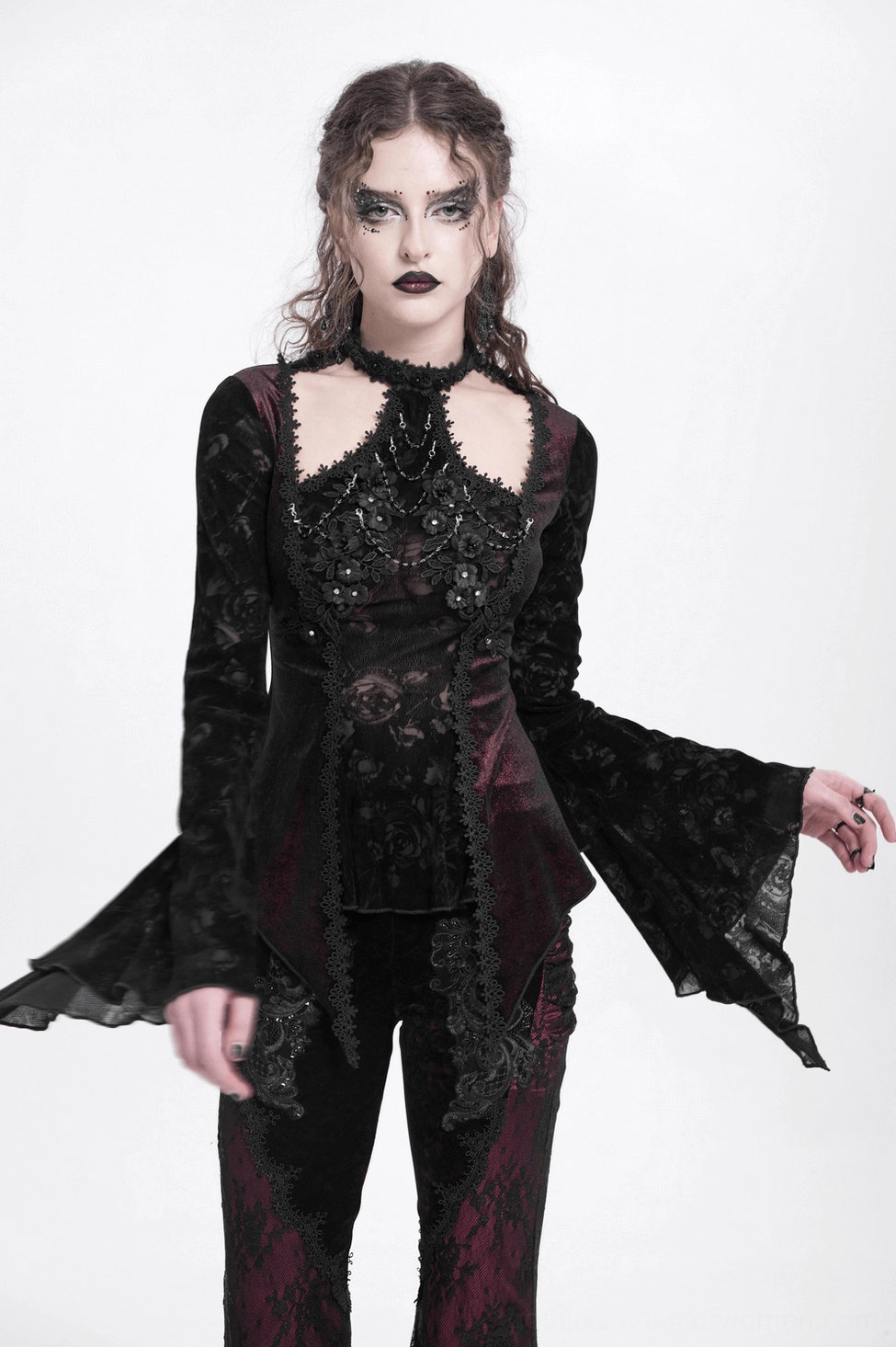 Gothic lace bell sleeve top - three-quarter rear view displaying back velvet panel and asymmetrical hem design