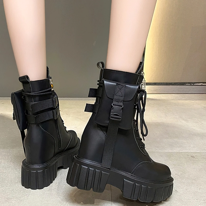 Gothic platform combat boots close-up showing lace-up system, side zipper, and structured heel design