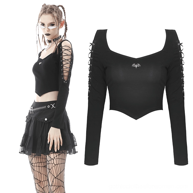 Gothic crop top styled with fishnet stockings, pleated mini skirt and choker accessories for alternative fashion look
