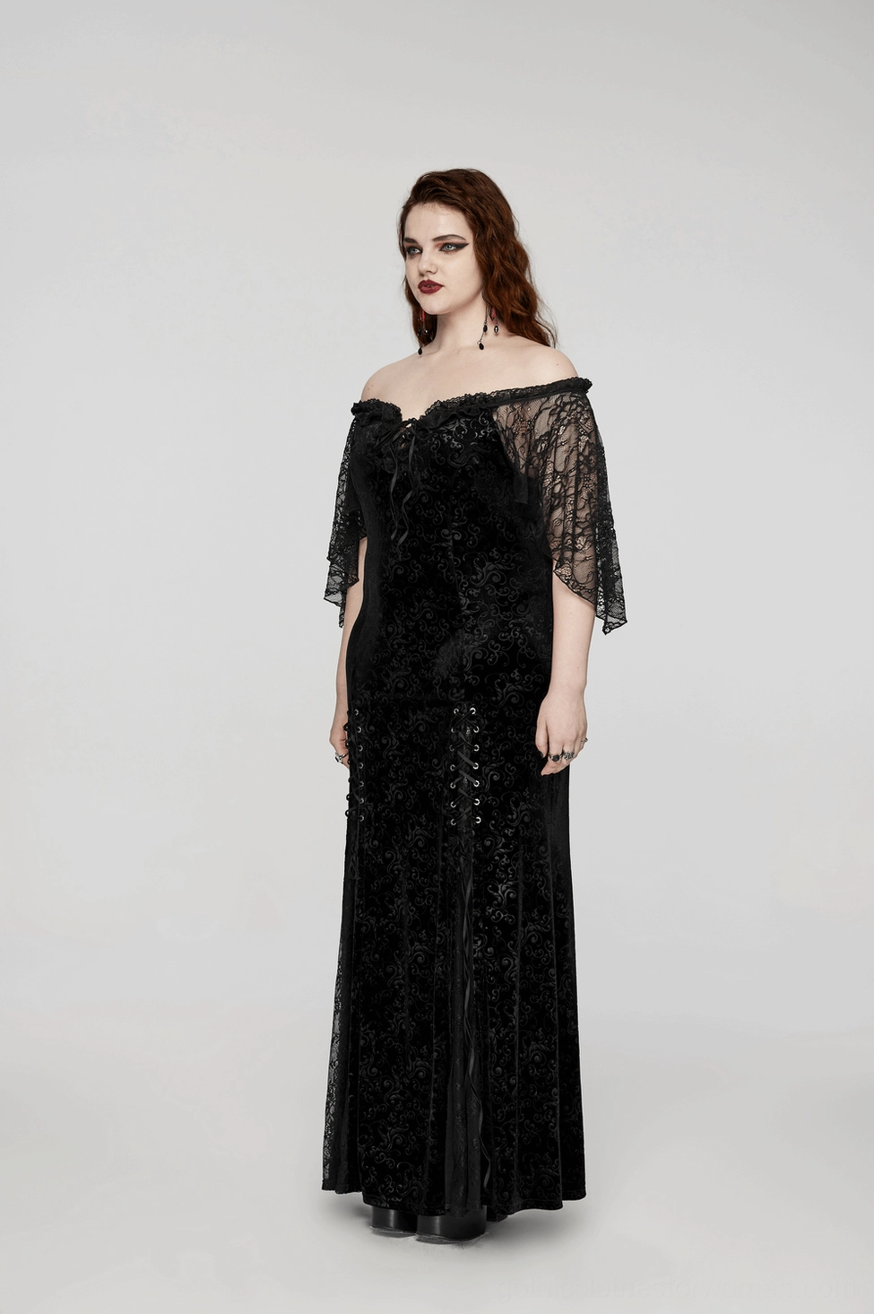 Gothic velvet lace-up maxi dress worn by model, showcasing the dramatic floor-length silhouette and plum blossom eyelet details
