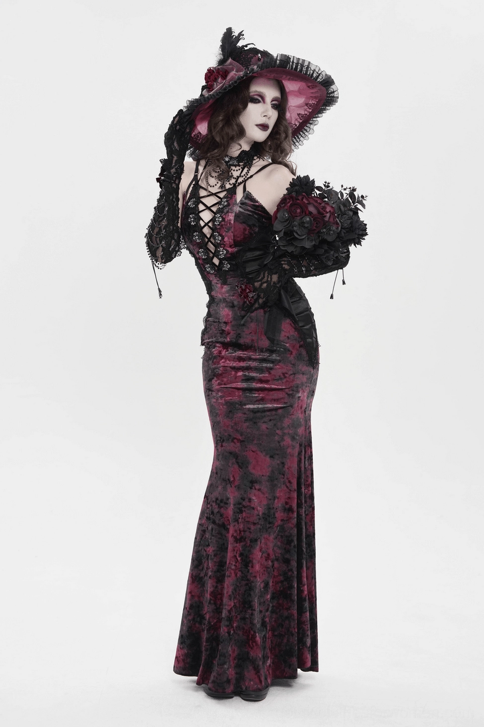 Side view of burgundy black tie-dye gothic dress with lace-up front and spaghetti strap design on mannequin form