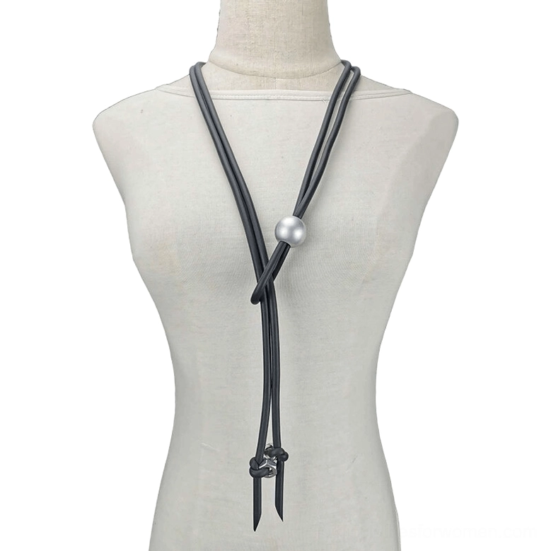 Black rubber gothic lariat necklace with silver pearl and metal screw adjusters displayed on dress form mannequin front view