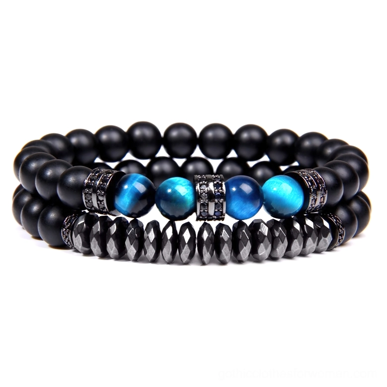Dark stone beaded bracelet with black matte beads, blue tiger eye accent, and silver rhinestone metal spacers detail view