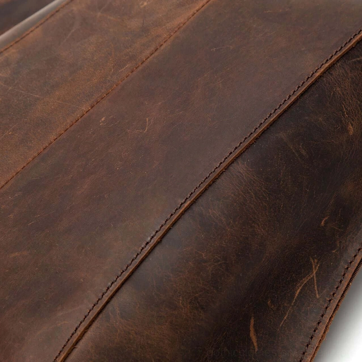 Tan leather gothic backpack capacity demonstration showing practical storage space and organization