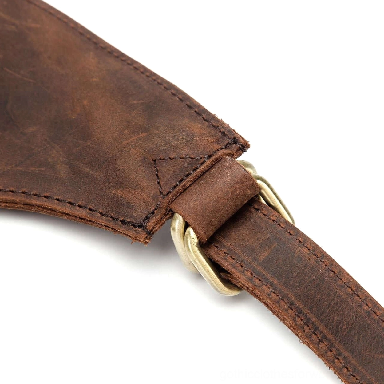 Tan leather gothic backpack profile view showing depth and structural integrity of design