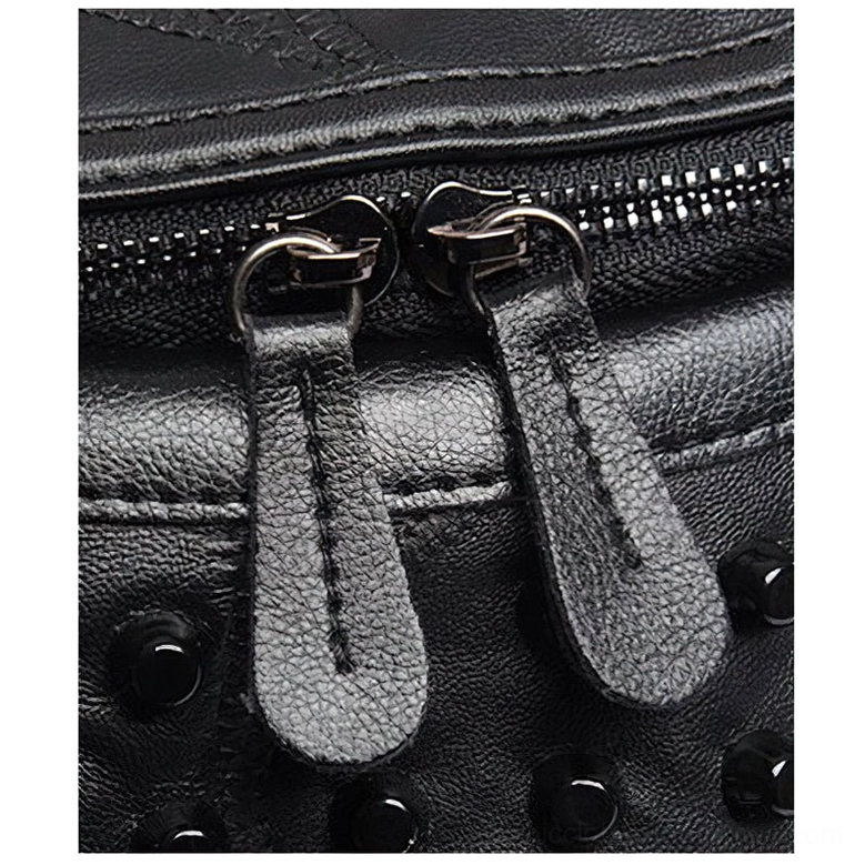 Direct rear view of compact black leather messenger bag featuring exterior zipper pocket and side rivet embellishment with top hanging loop