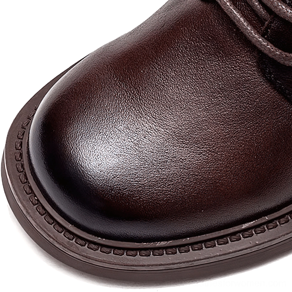 Gothic lace-up leather ankle boots construction detail showing lacing system and leather quality