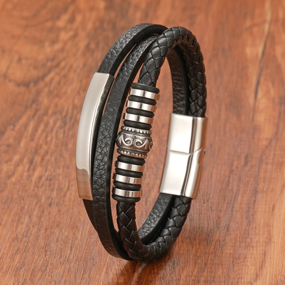 Black leather gothic bracelet close up side view with vintage engraved metal hardware and stainless steel components