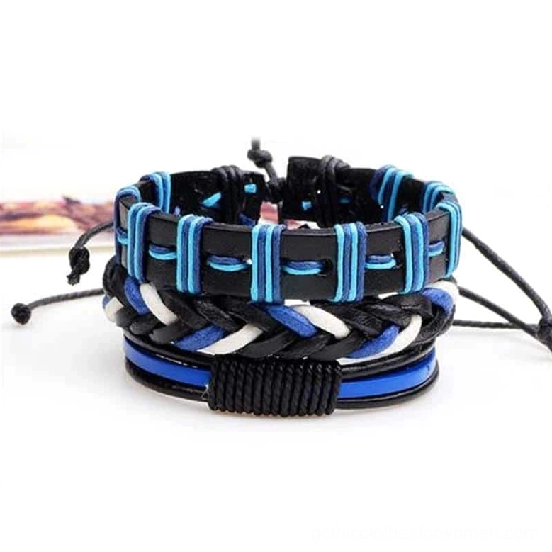 Stacked black and blue gothic leather bracelets with rope construction and pull-tie closure