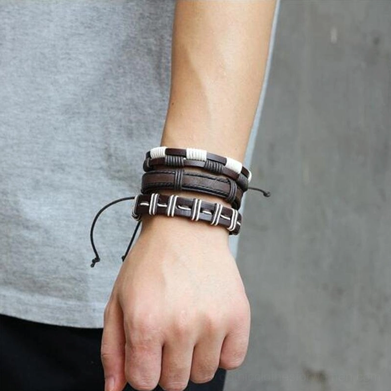 Stacked gothic leather bracelet set on male model wrist showing brown leather with white stripe accents, multiple layers side close-up styling
