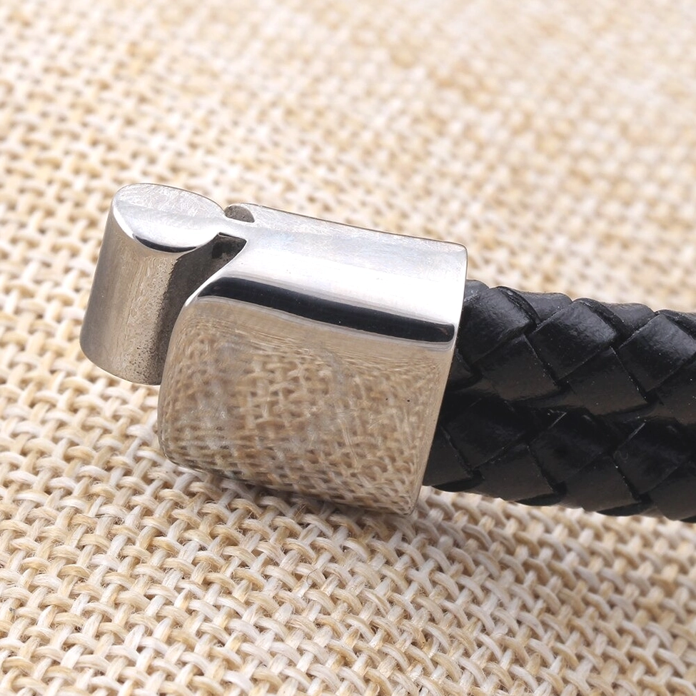 Front oblique view of stainless steel toggle closure mechanism on gothic leather bracelet