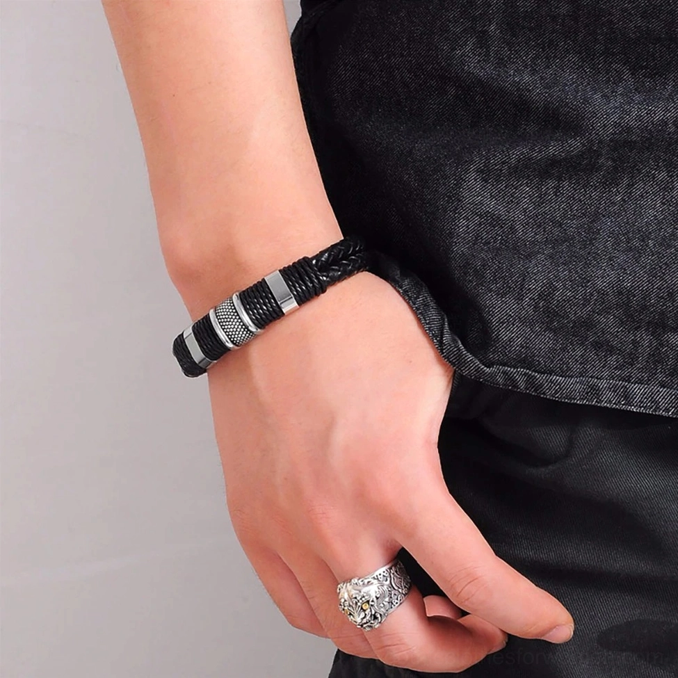 Model wearing black braided leather gothic bracelet with stainless steel accents on wrist