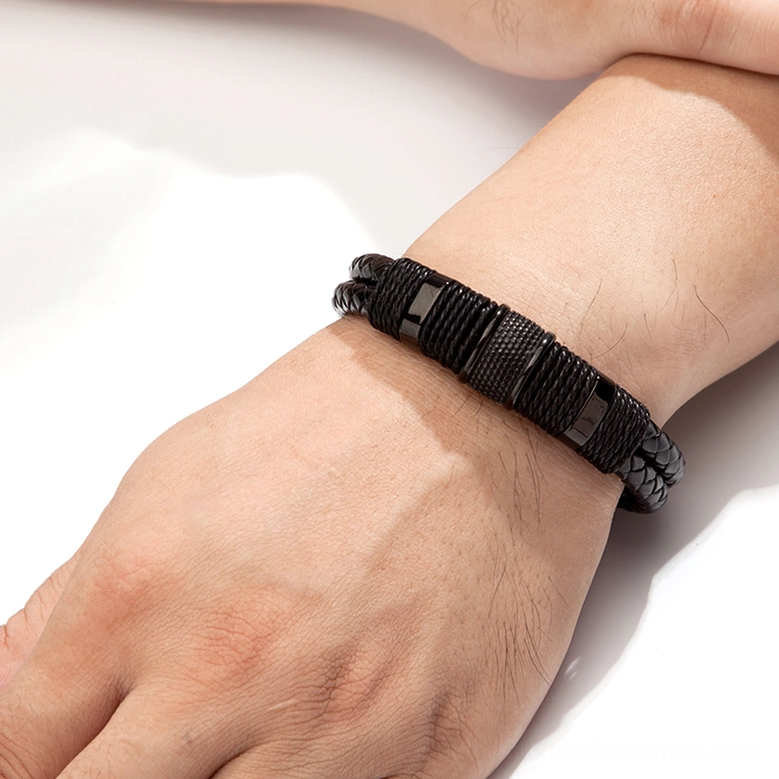 Men's double-layer woven leather gothic bracelet on wrist, side view showing texture and gun-black finish