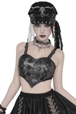 Gothic faux leather lace-up buckle bralette crop top worn by goth model in front three-quarter view showing heart-shaped cups and metal buckle fasteners
