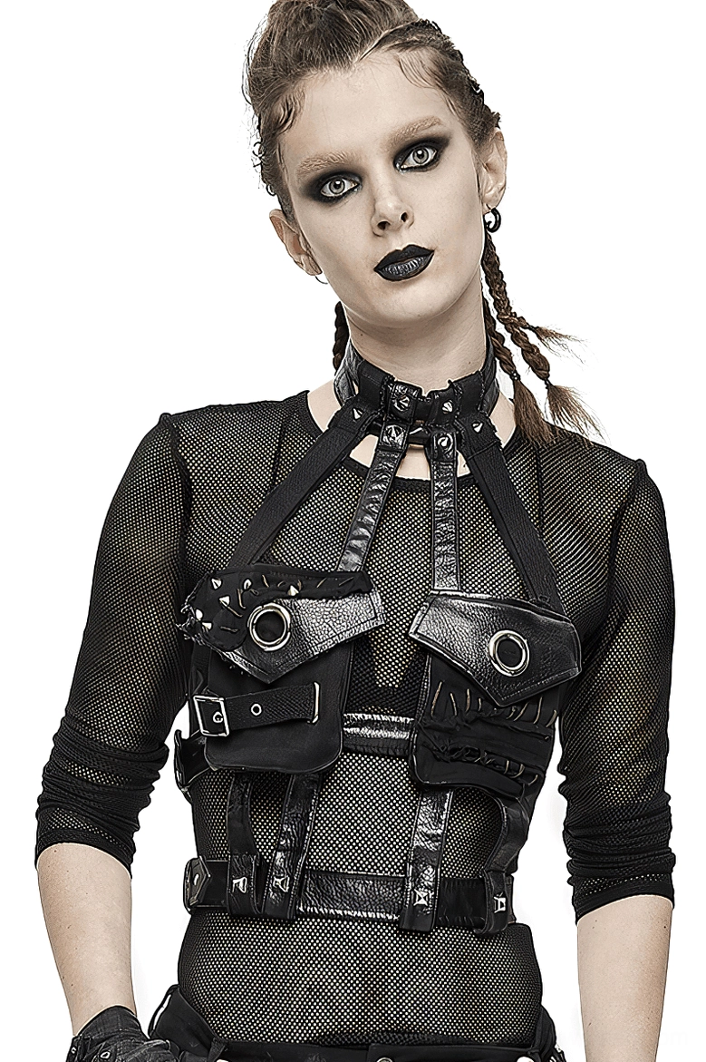 Black faux leather gothic chest harness with metal rivets worn by alternative fashion model, front three-quarter view showcasing adjustable straps and design details