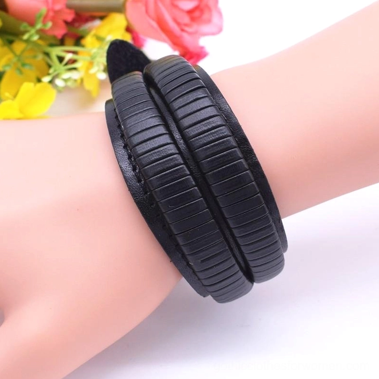 Wide gothic leather cuff bracelet styled presentation highlighting vintage leaves design and genuine leather texture
