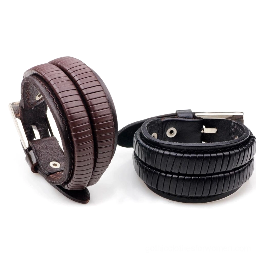 Dual-color gothic leather cuff bracelets front oblique view comparing black and brown styles with leaf motif details