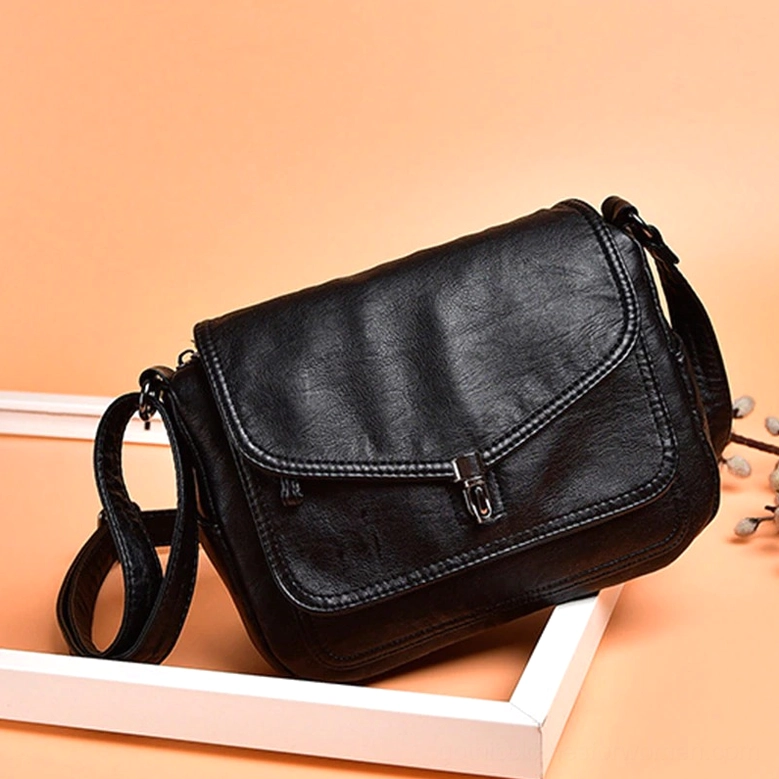 Gothic leather handbag front detail, soft crossbody bag with flap closure