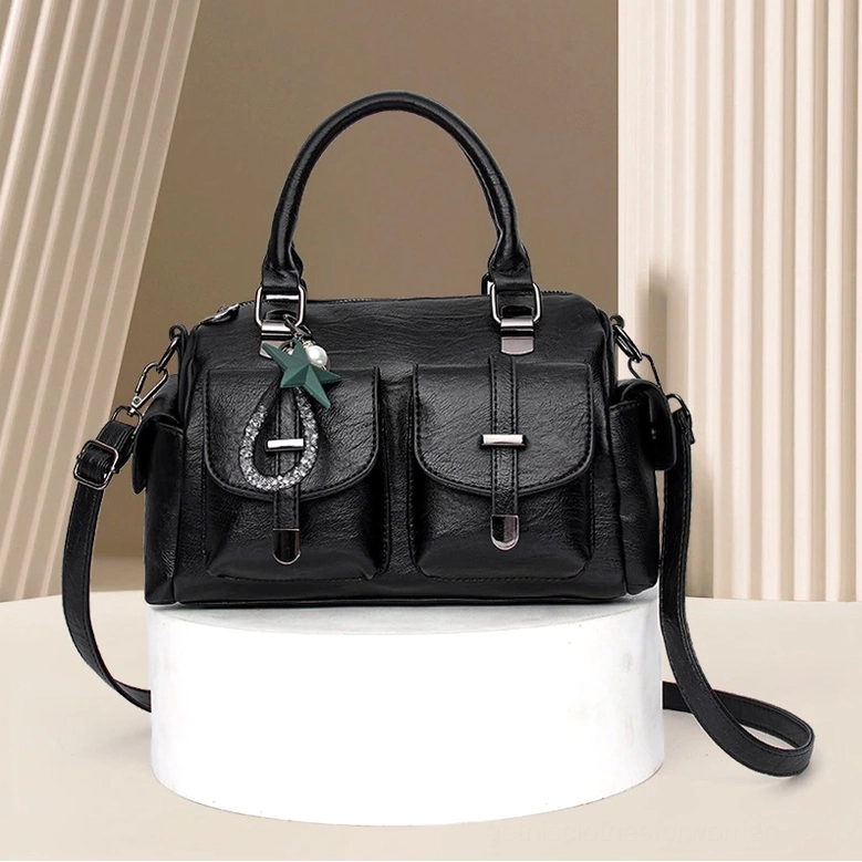 Worn styling of gothic star pendant leather handbag - everyday dark aesthetic accessory for alternative fashion