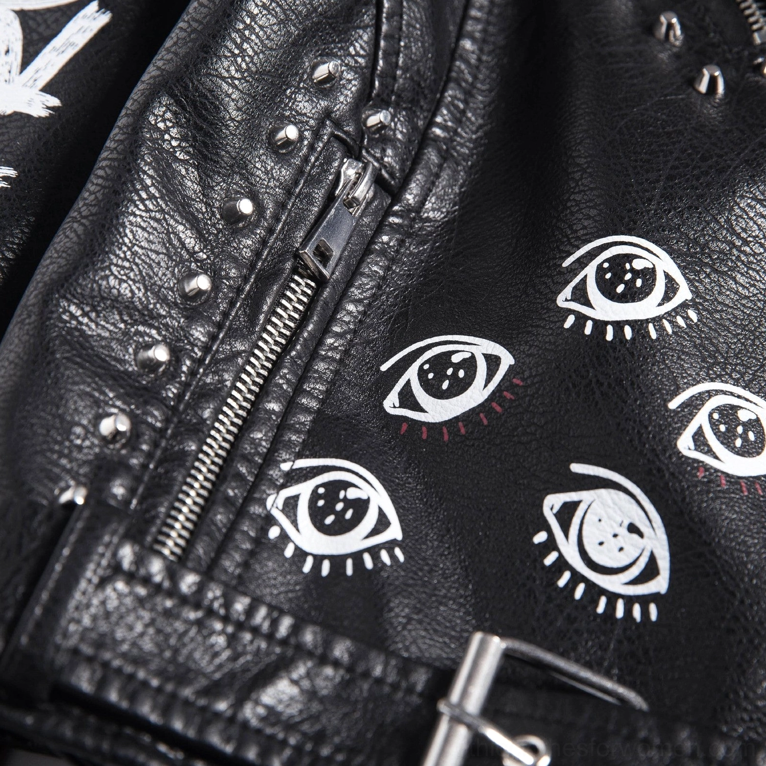 Back view angle black faux leather jacket showing DARE YOU print placement studs and decorative composition