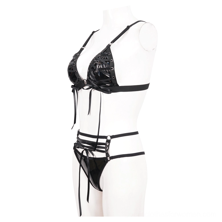Black faux leather gothic lingerie set on mannequin showing side lace-up trim, strappy bottoms, and architectural design details