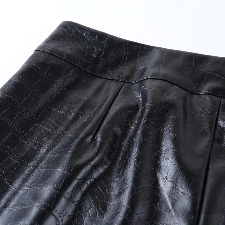 Back-waist detail of black high-waist gothic faux leather pencil pants on model, showing premium stitching and fit construction