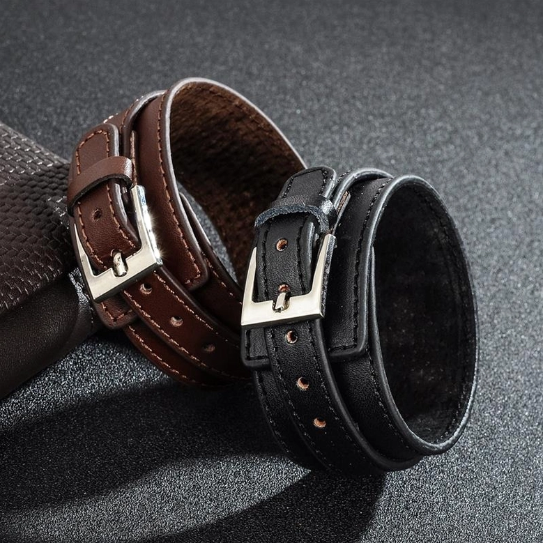 Black and brown gothic leather wristband comparison, both colors side by side showing punk rock aesthetic and metal buckle hardware
