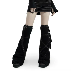 Black gothic leg warmers with cross leather straps and metal buckles worn by female model in black mini skirt, front view