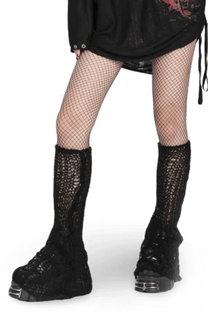 Black mohair striped leg warmers worn on model with fishnet tights and platform boots, front three-quarter view gothic fashion styling