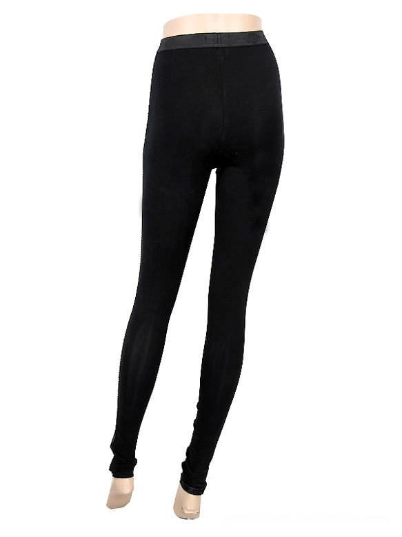 Black tight gothic leggings rear view on mannequin with elastic waistband and form-fitting cut, white studio background