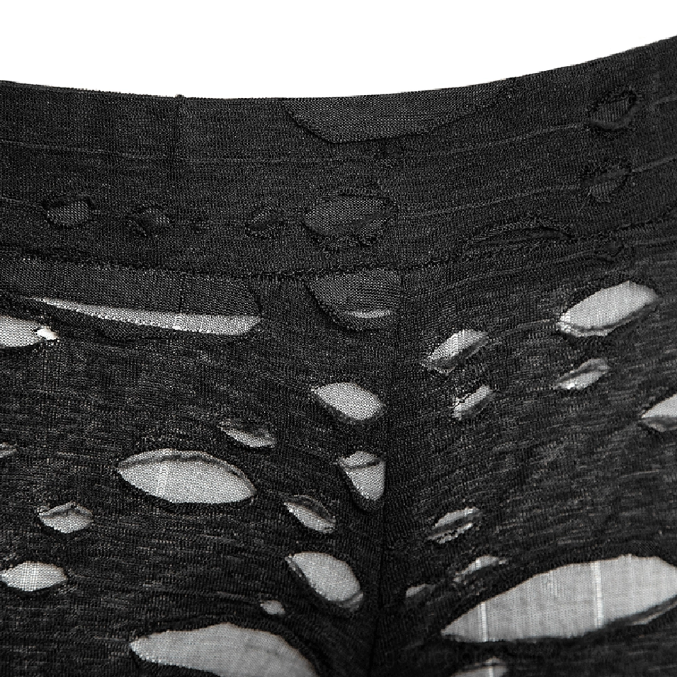 Close-up of black knit fabric with ripped mesh panel details on gothic leggings waist