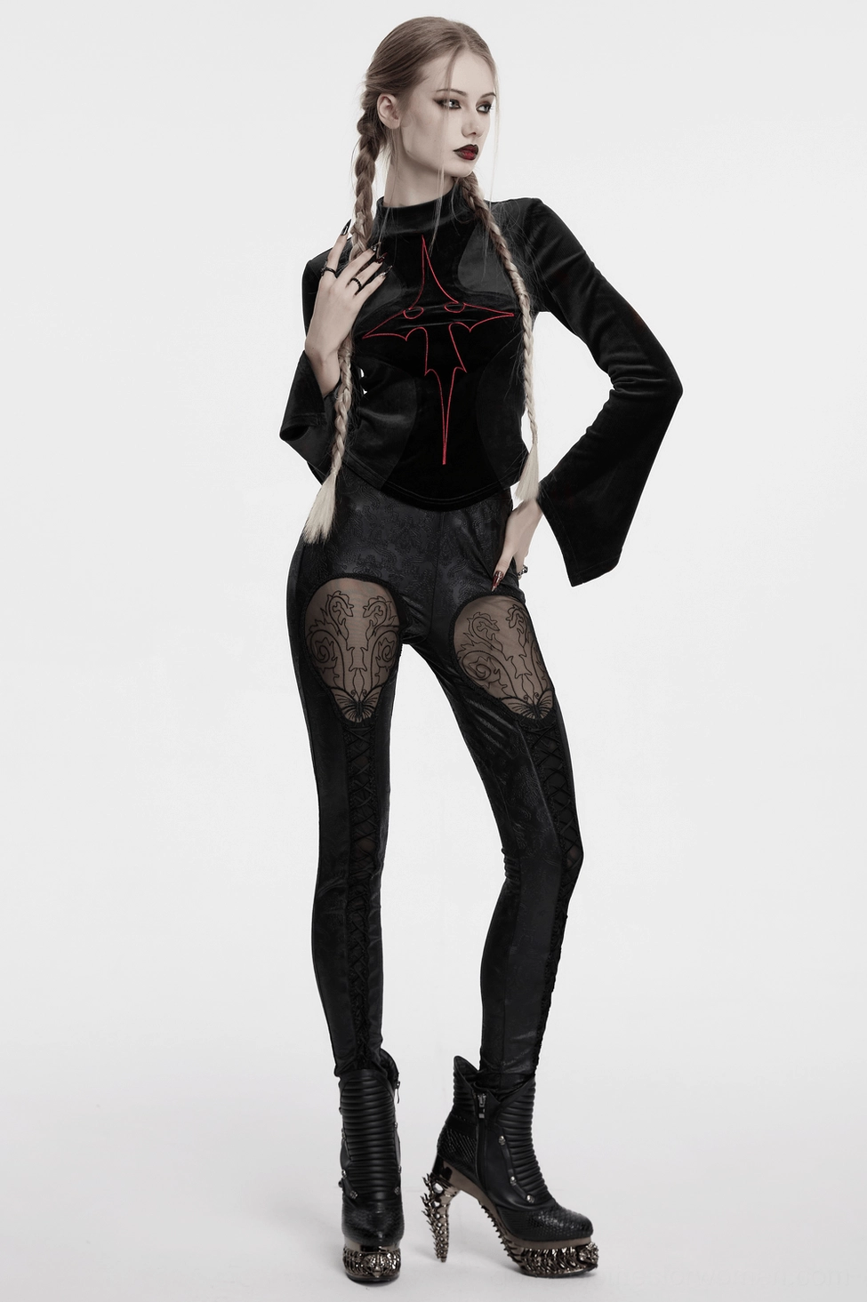 Gothic leggings with embossed pattern and strategic mesh panels, detailed view