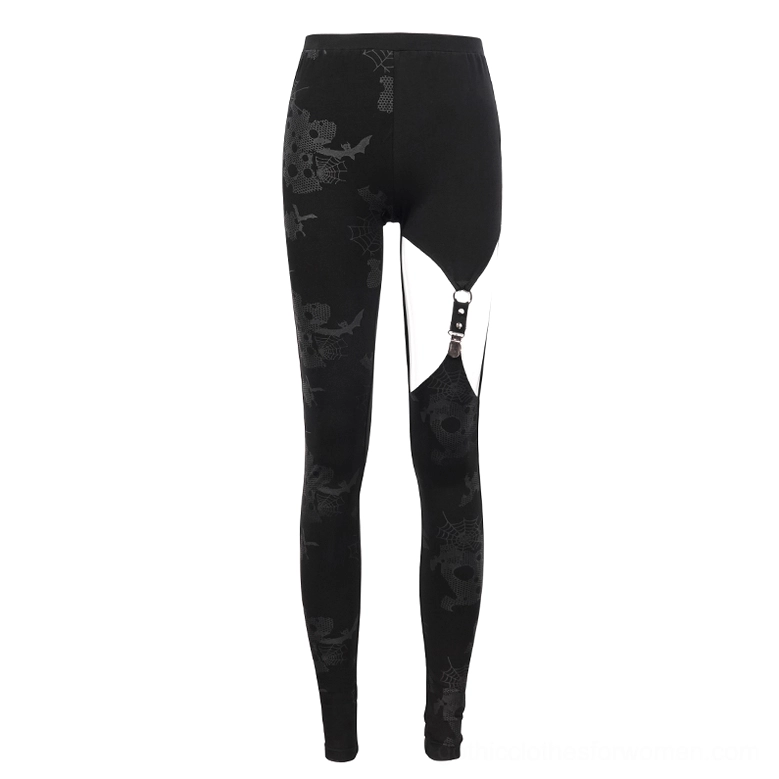 Black asymmetrical gothic leggings flat lay product display showing horror-inspired print design and metal buckle thigh detail