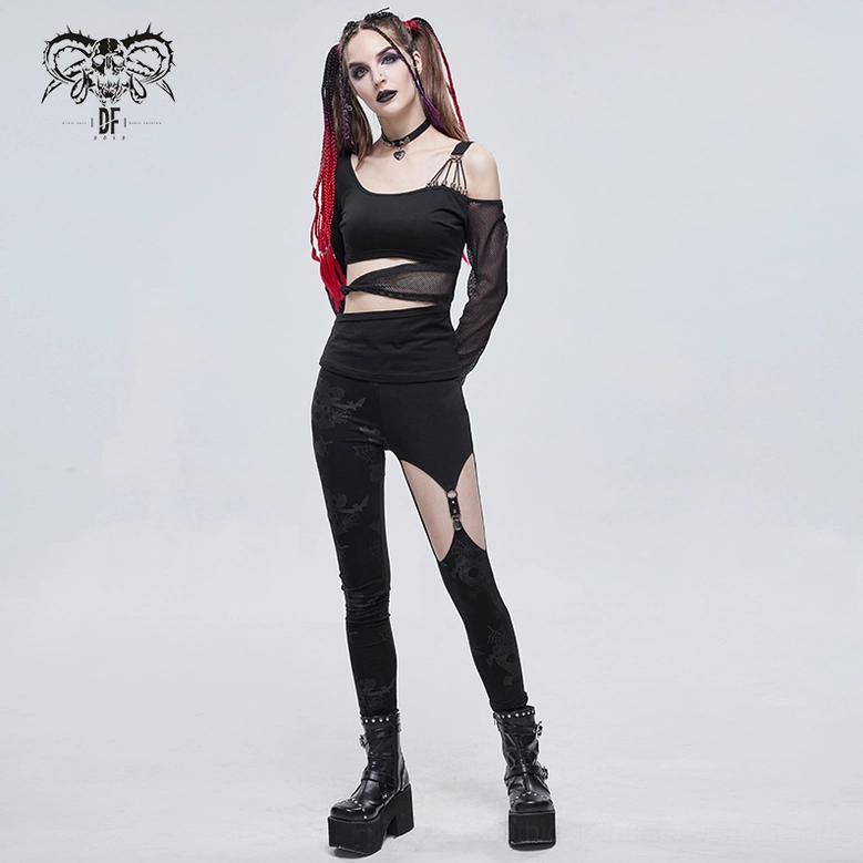 Black asymmetrical gothic leggings flat display showing full garment with metal buckle cutout and horror print throughout