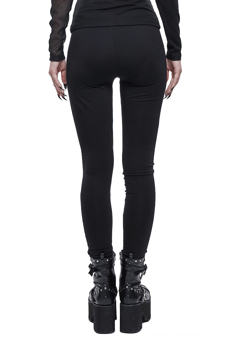 Asymmetrical punk gothic leggings rear full view showing fitted silhouette with dark prints, styled with platform combat boots
