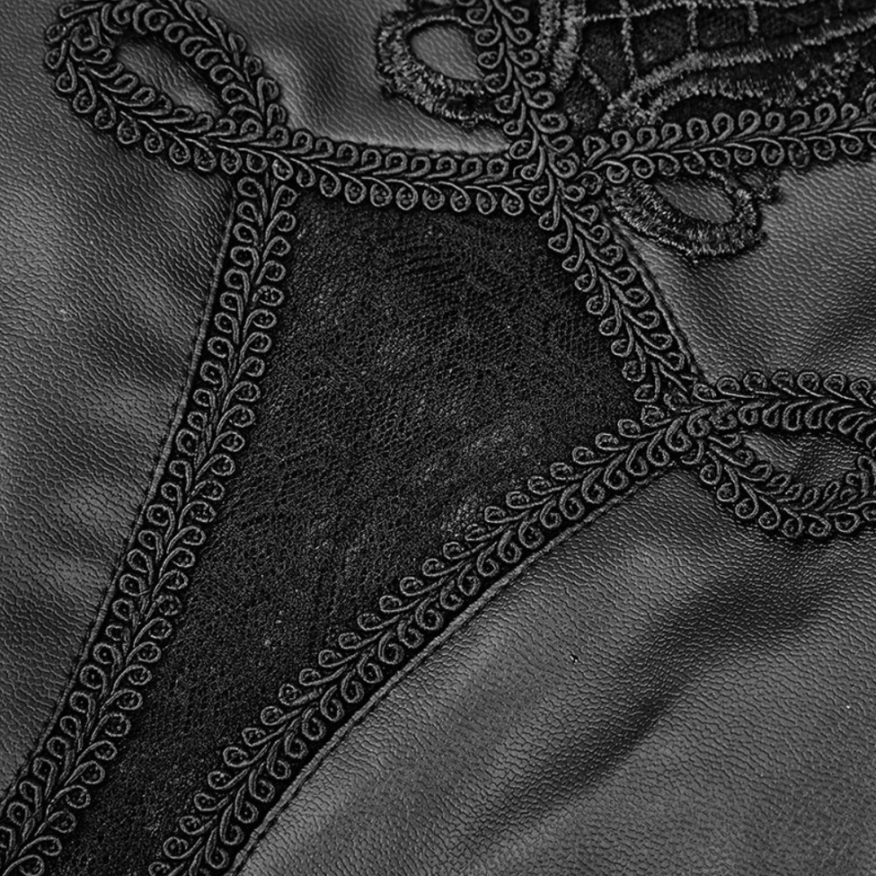 Close-up detail of intricate lace embroidery on black faux leather gothic leggings