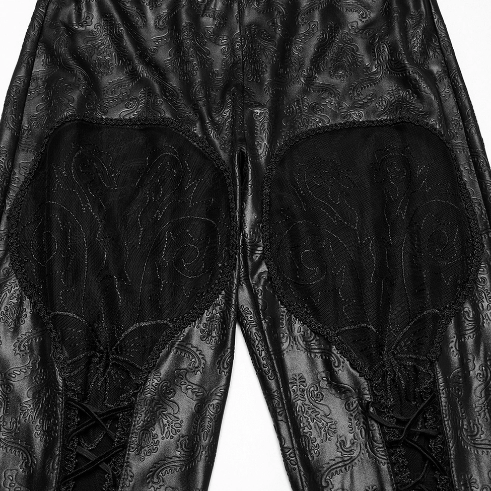Close-up of embroidered mesh lace-up front detail on gothic hollow out leggings