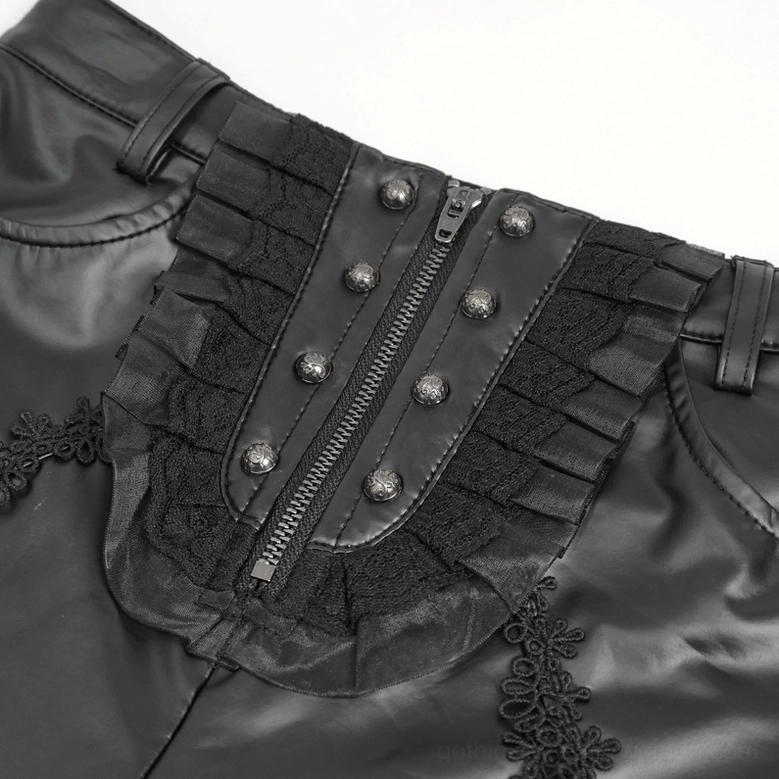 Close-up detail of black gothic leggings waist area showing zipper closure and decorative buttons with ruffled lace