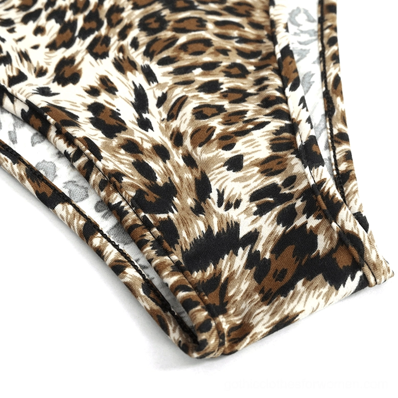 Leopard print bikini bottom fabric detail close-up, showing animal print pattern with visible inner lining construction