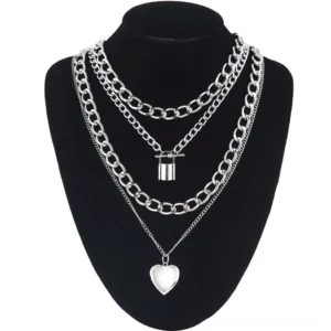 Multi-layered lock and heart gothic chain necklace displayed on black mannequin bust, front view with silver metal chains and romantic pendants