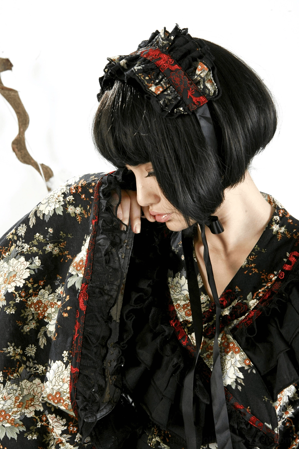 Gothic lolita dress sleeve detail showing dramatic bell-shaped cuffs and ruffled edges