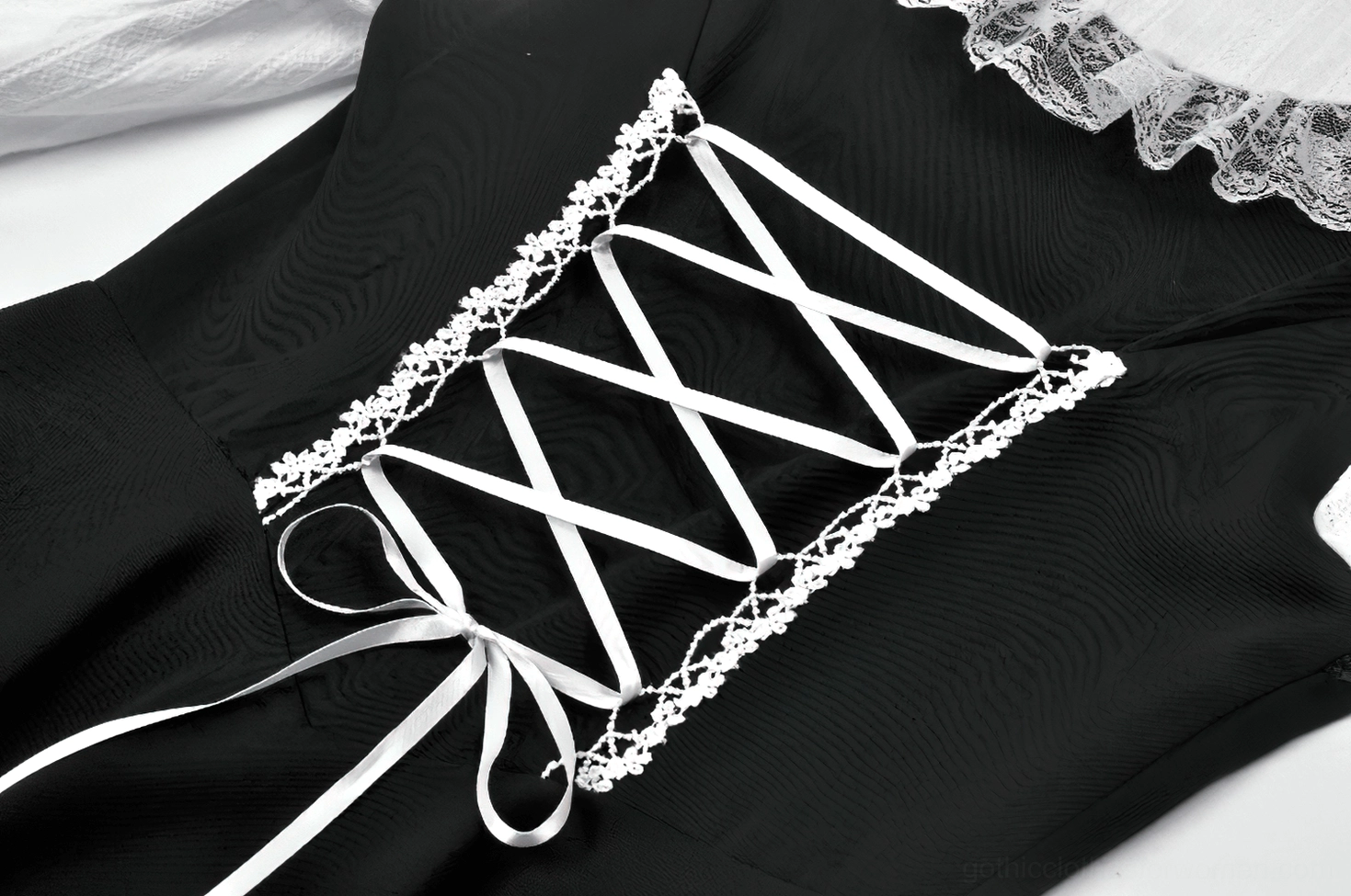 Gothic lolita dress corset back lace-up close-up with lace-trimmed corset lacing and satin ribbon bow detail