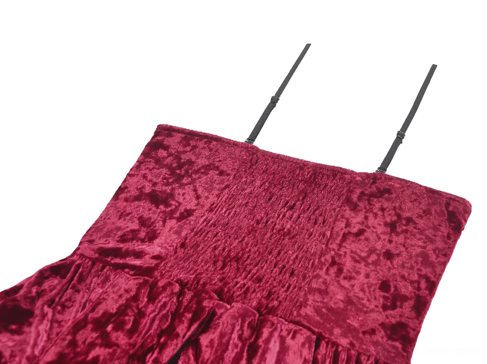 Detailed view of fabric construction showing crushed velvet texture, lace panel integration, and ruffled hem details