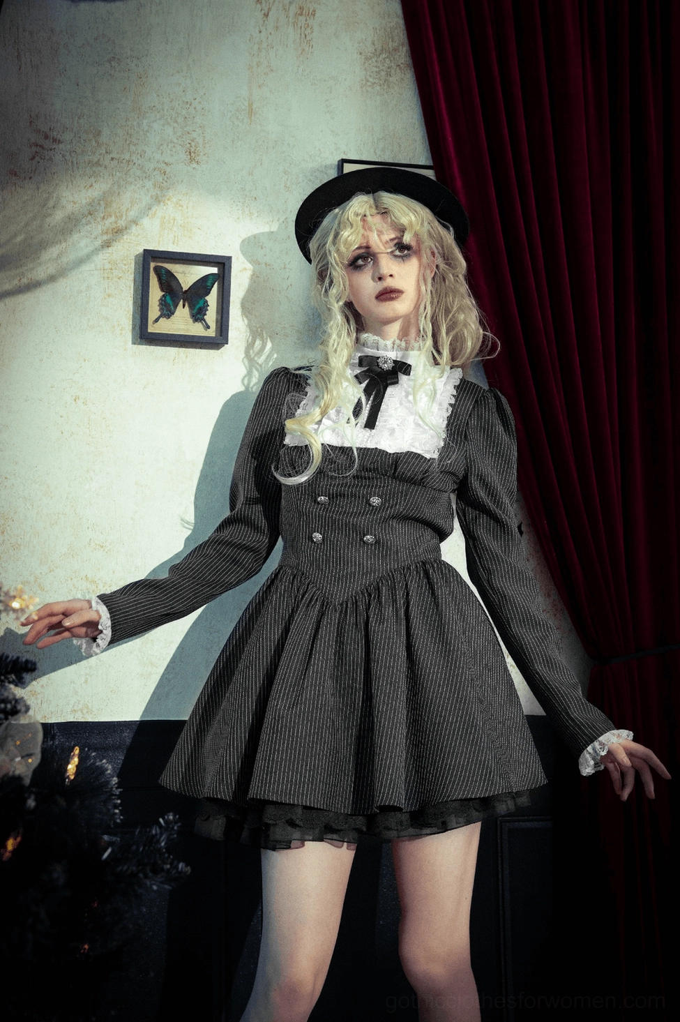 Full-length view of black pinstripe gothic lolita dress demonstrating proportions and overall aesthetic impact