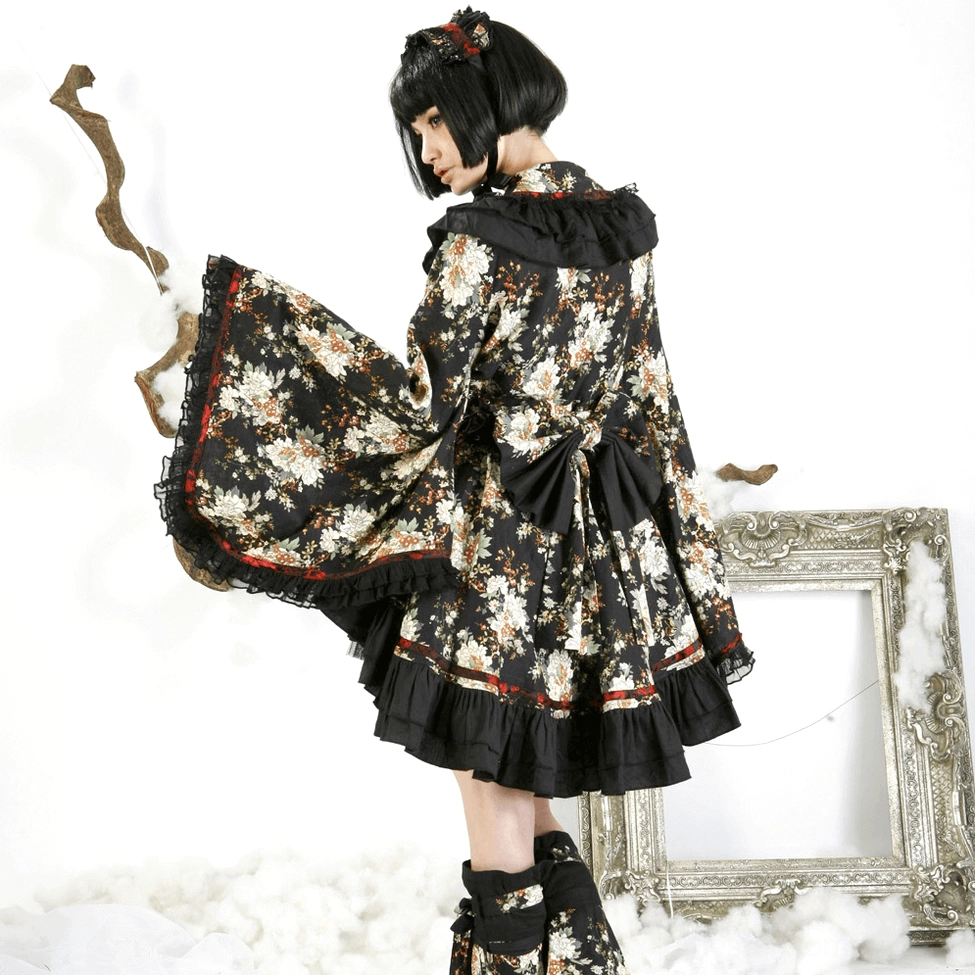 Gothic lolita dress on model showing movement and drape of tiered skirt construction