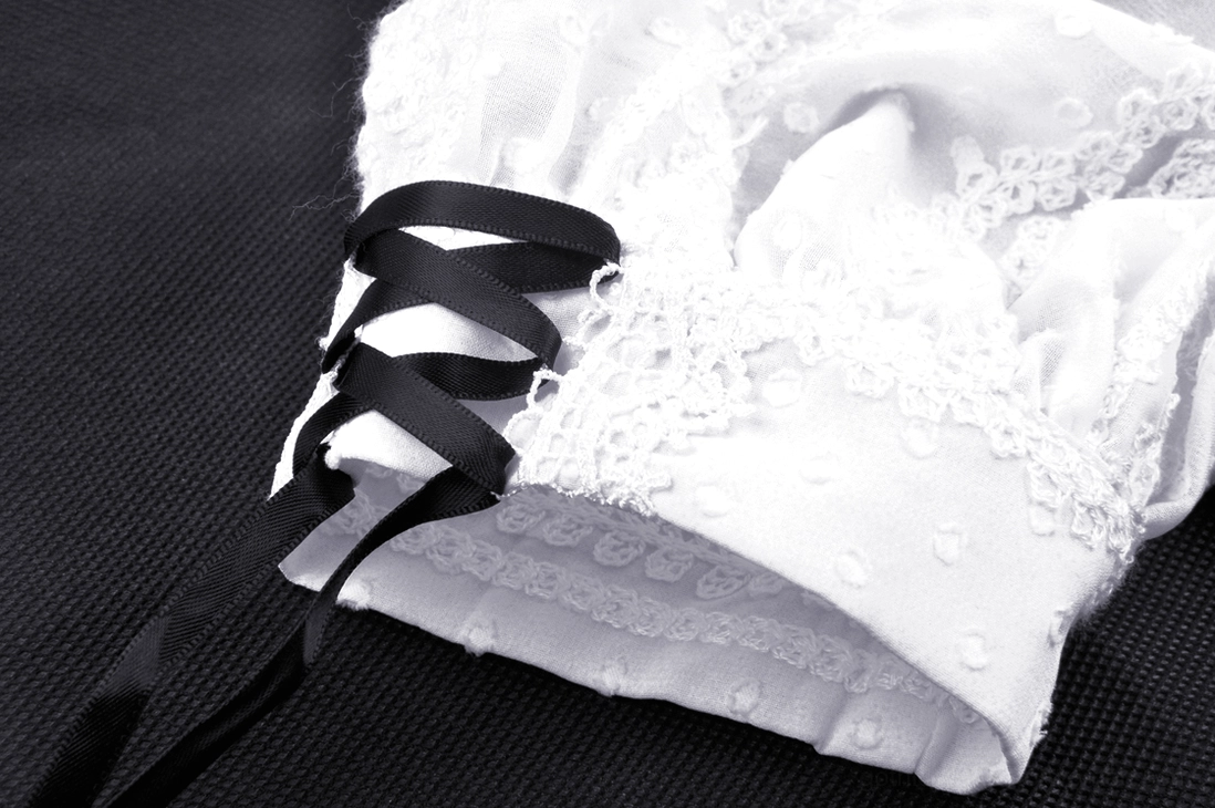Gothic Lolita midi dress styling detail with puff sleeves and contrasting black-white aesthetic