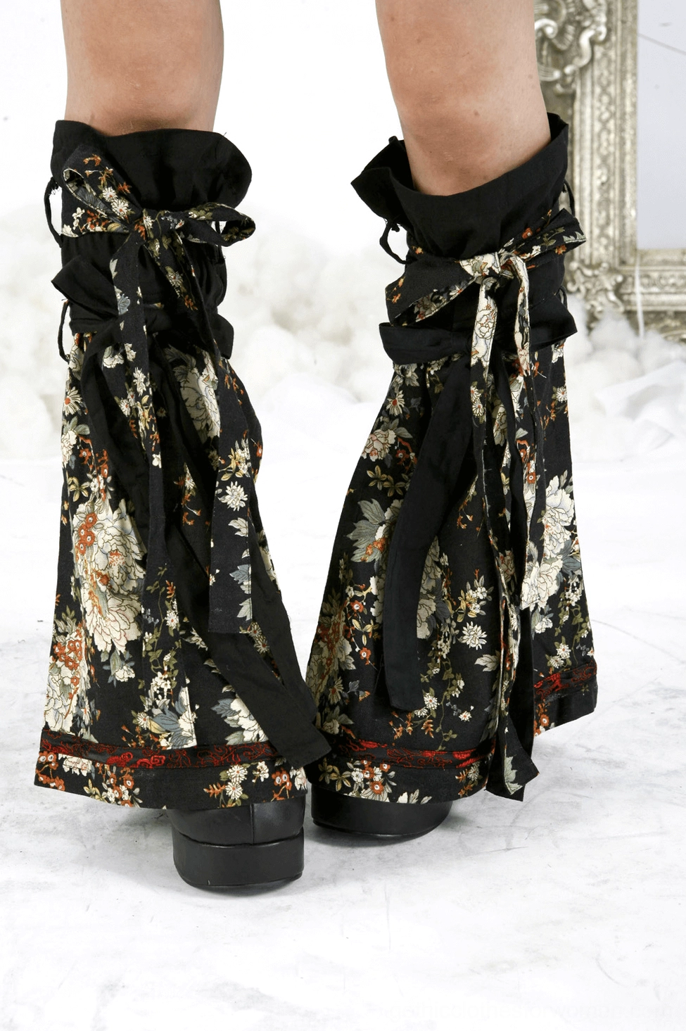 Black gothic lolita dress three-quarter length view with leg warmers and full silhouette display