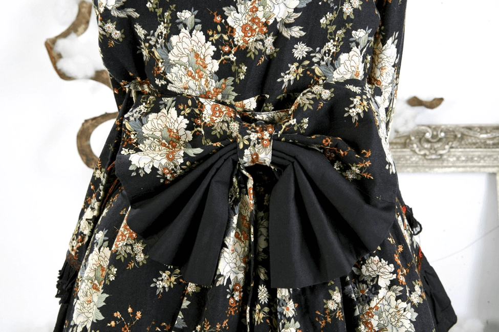 Gothic lolita dress skirt layers and ruffles close-up showing architectural silhouette design